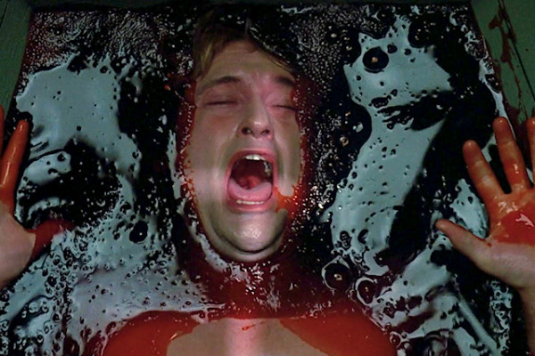 Dr. Alan drowning in blood in a nightmare in the serpent from the rainbow horror film