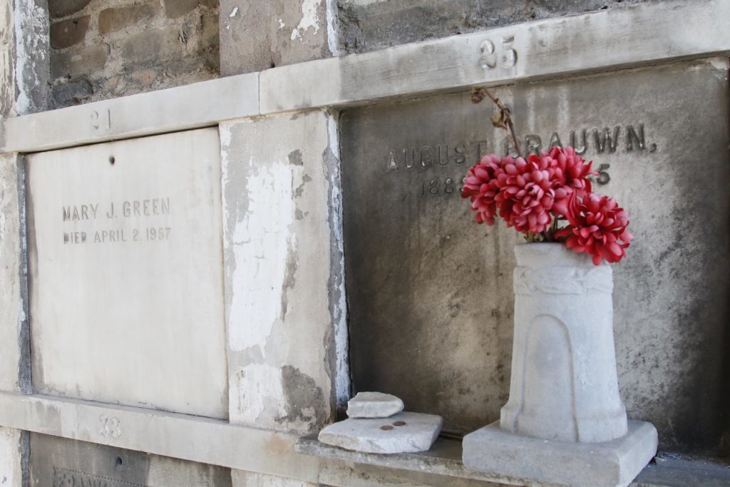 Lafayette Cemetery 2 Puzzle Box Horror images red flowers in tomb