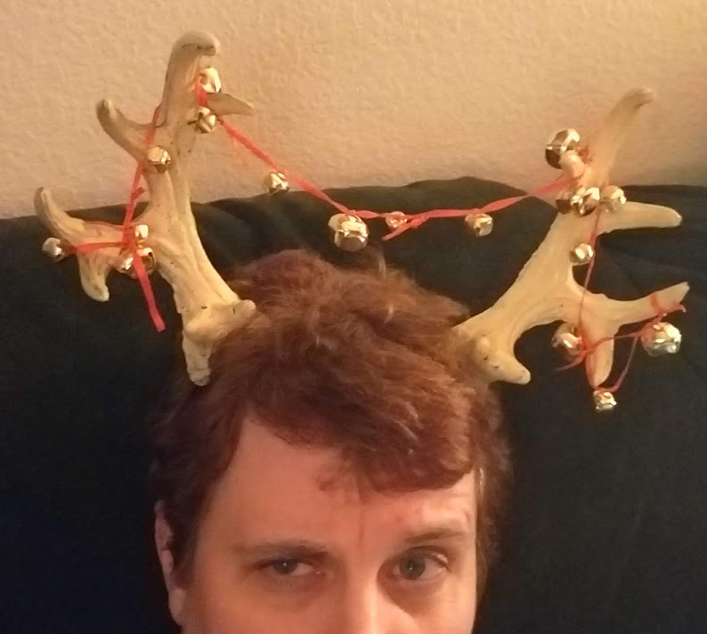 Author Kris Silva wearing antlers