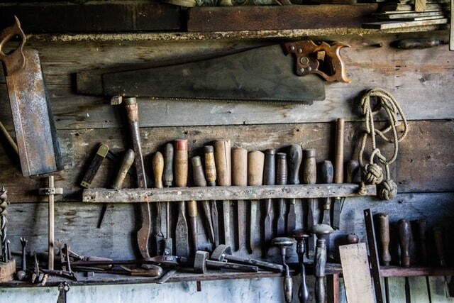 Old rusty tools in a toolshed
