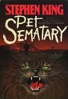 Stephen King Pet Sematary book cover with cat and graveyard