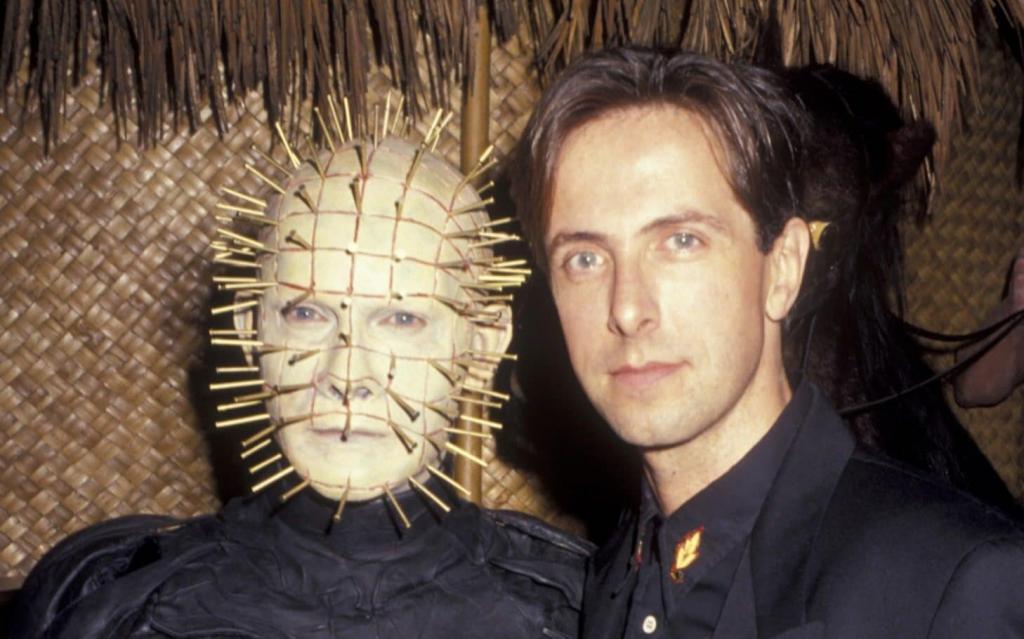 Clive Barker and Doug Bradley dressed as pinhead character from Hellraiser horror movie franchise