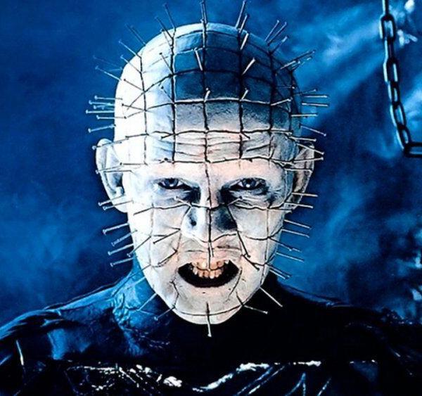 clive barkers pinhead character showing demon with pins in his face and head