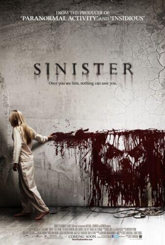 sinister horror movie poster featuring a scary young girl walking by a blood stained wall